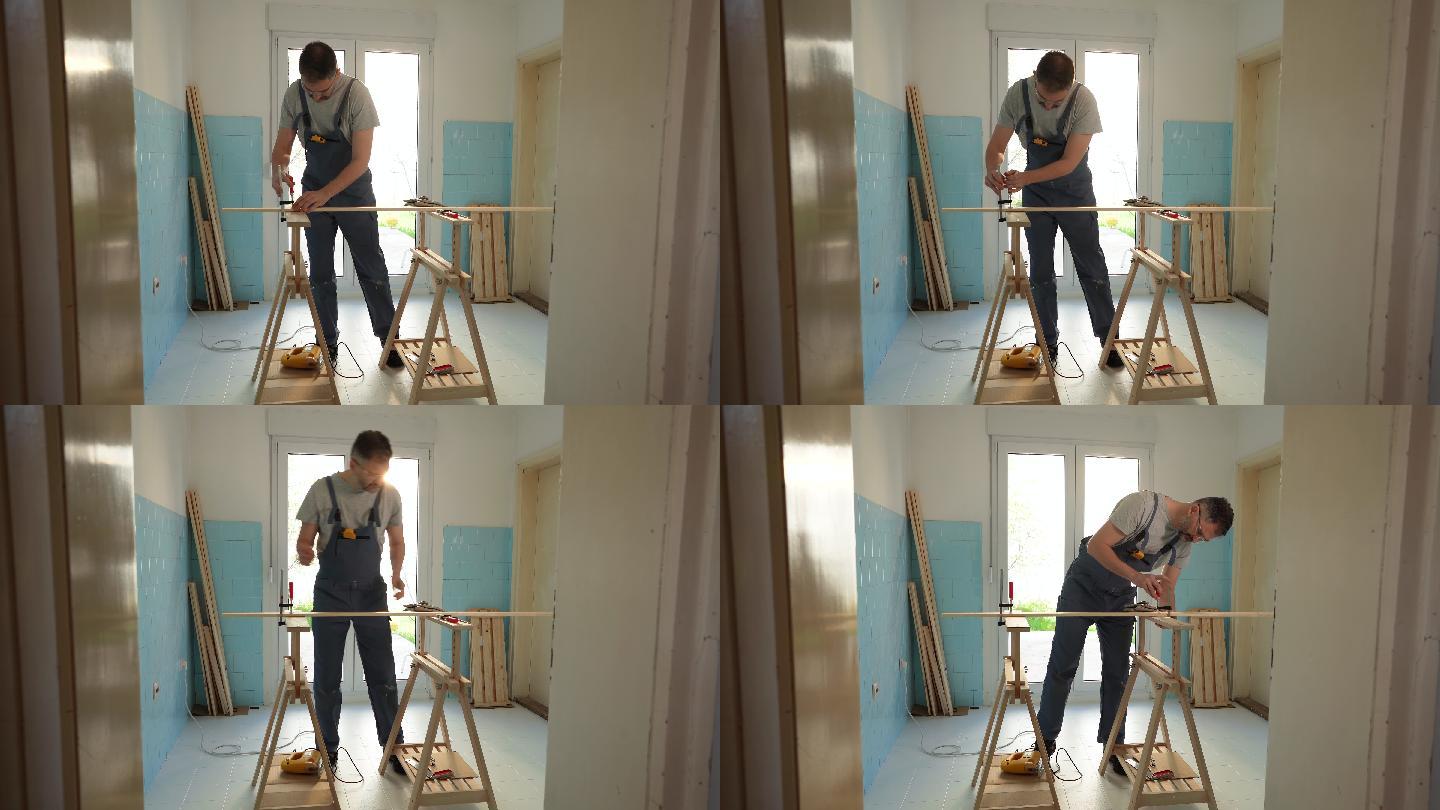 高加索男性木匠，在厨房用夹子连接家具