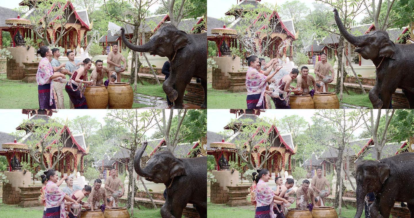 泰国和老挝的一群男孩和女孩在泼水节泼水