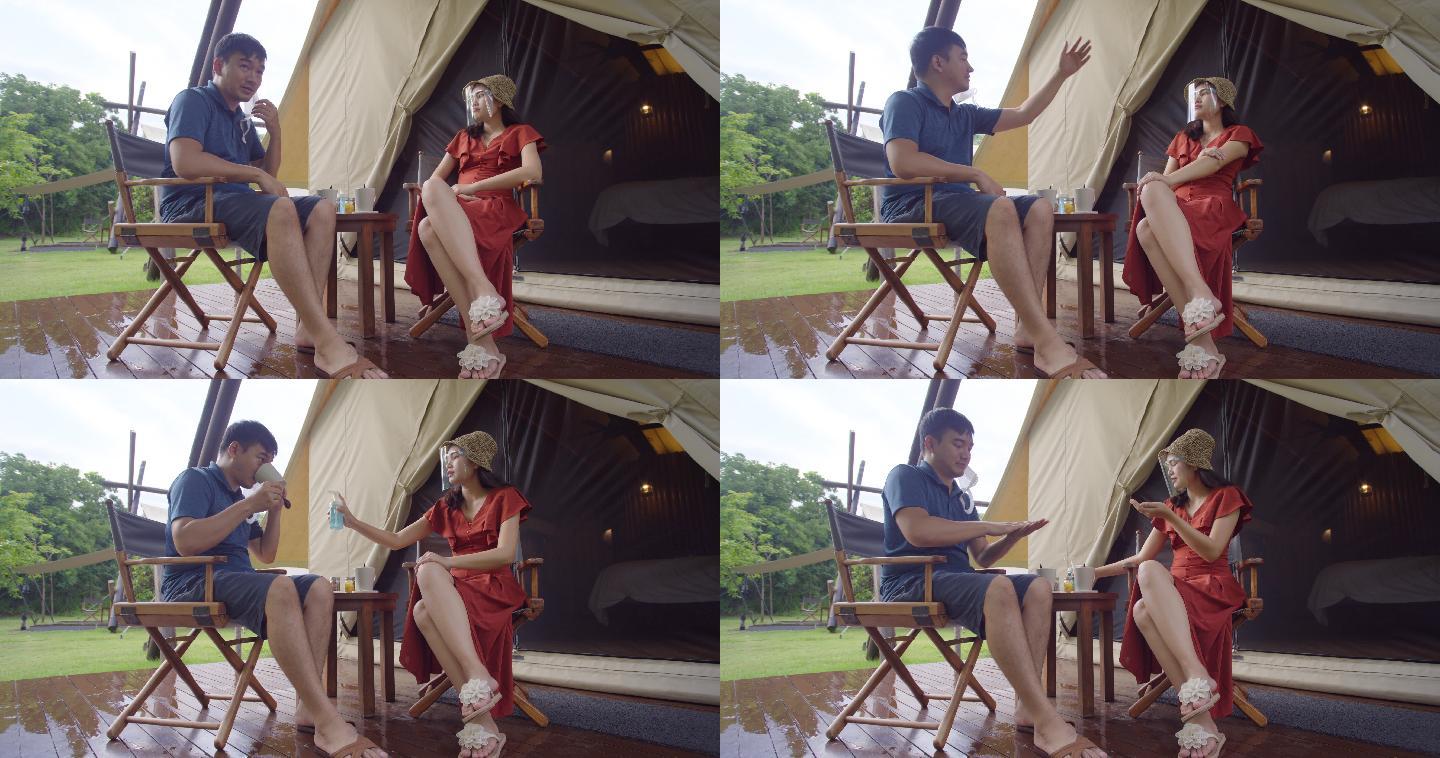 亚洲夫妇在自然的帐篷里休息