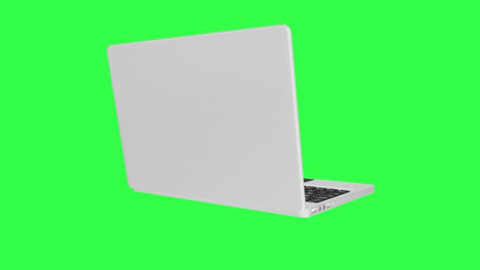 在绿色屏幕上旋转的笔记本电脑