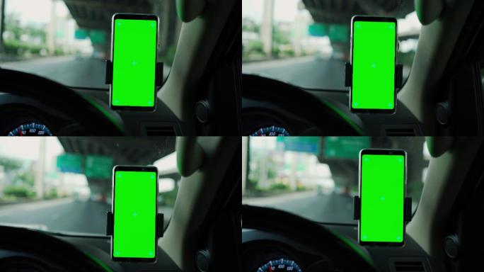 汽车仪表板绿色屏幕上的手机。