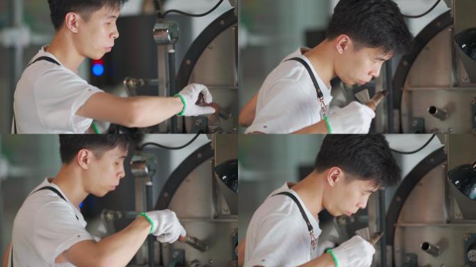 亚裔中国工匠微笑着拿着提尔从咖啡烤箱中提取咖啡豆烘焙生咖啡豆闻起来检查烘焙过程