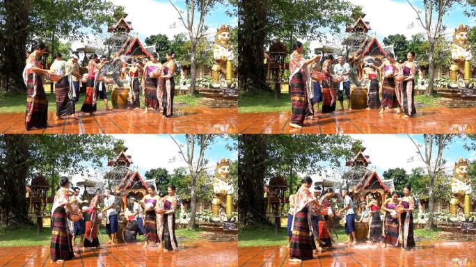泼水节-泼水节当天，美丽的女性穿着传统的泰国服装向寺庙里的男性泼水-4K