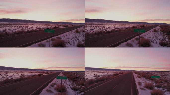无人机拍摄了科罗拉多州一个真实的路标，上面写着失望谷是一个完全绝望和沮丧的地方，有着美丽的日落