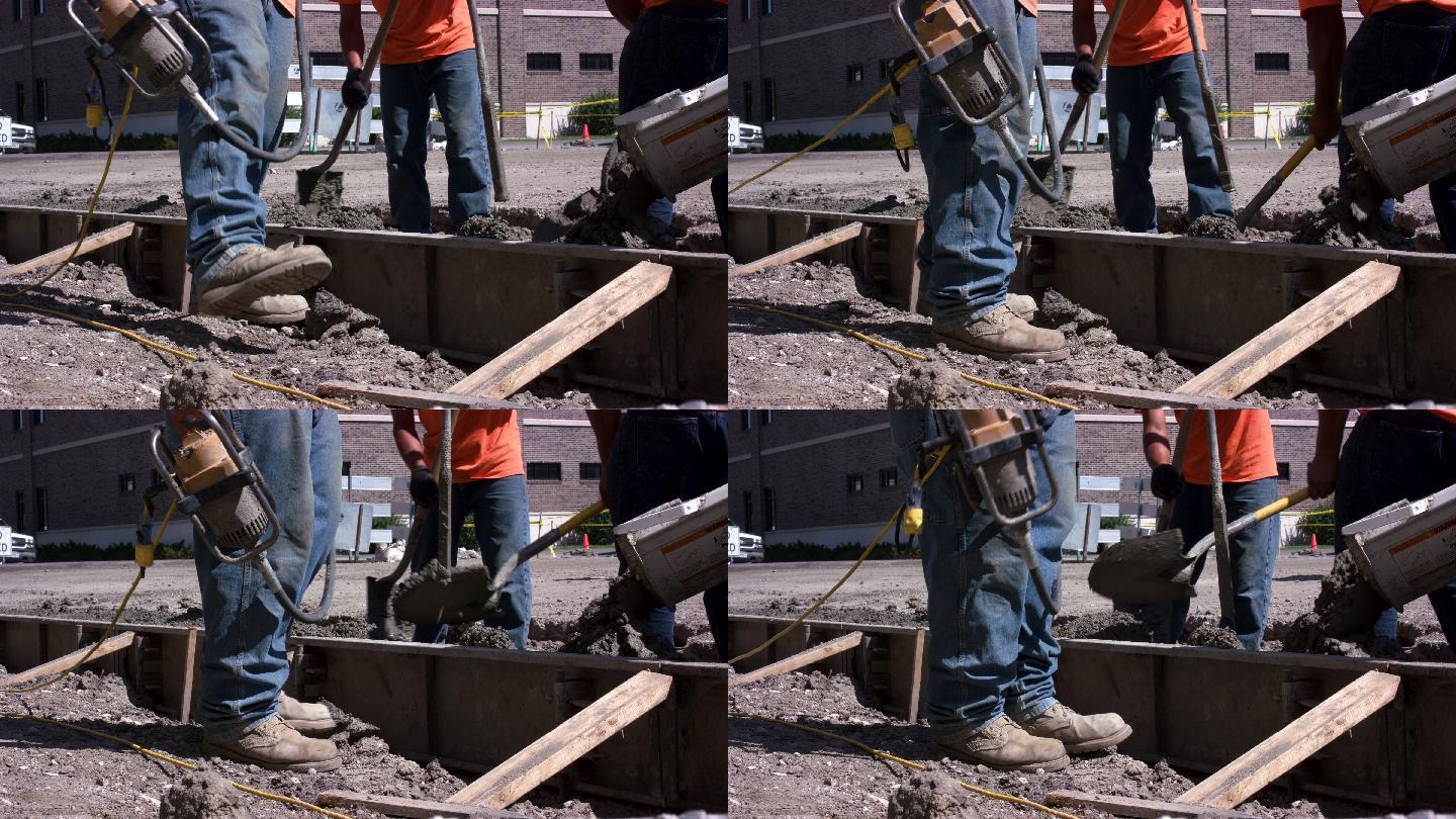 建筑工人铲湿混凝土