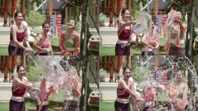 泰国和老挝的一群男孩和女孩在泼水节泼水