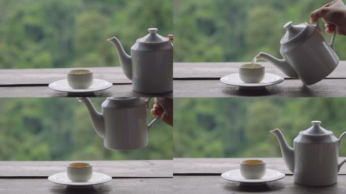 以茶园为背景倒热绿茶