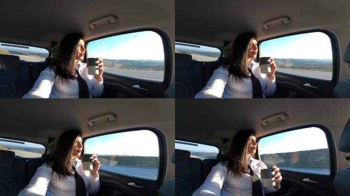 一位年轻的商业女性正在出差，一路上享受着阳光明媚的一天，用gopro相机拍摄自己，然后聊天。