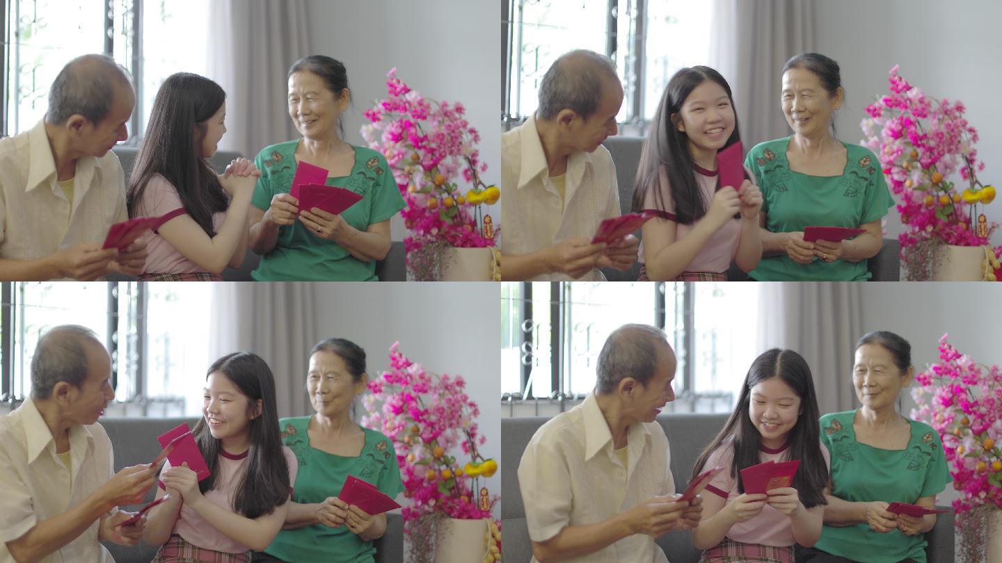 中国女孩在春节向祖父母祝福