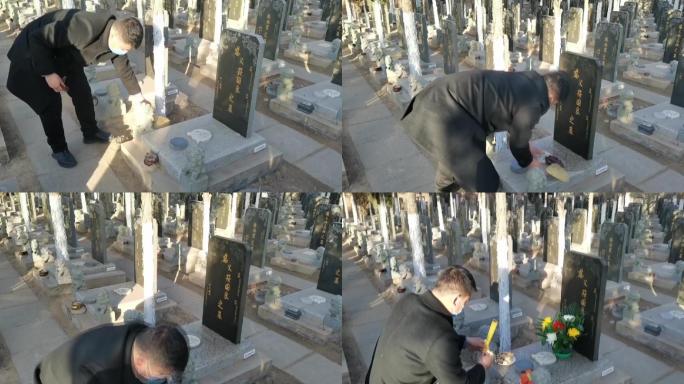 清明节男人在公墓祭拜亲人扫墓