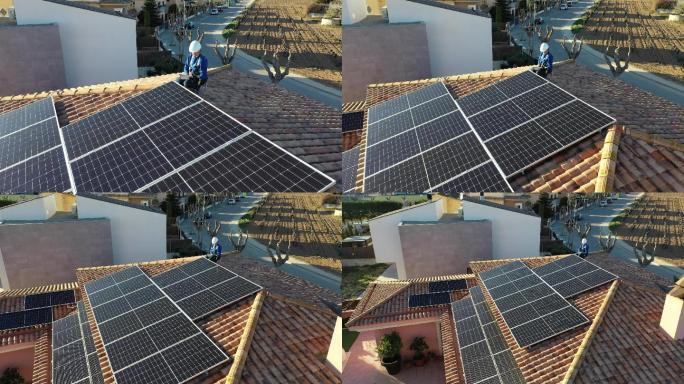 一名女技术员正在维修安装在家用屋顶上的太阳能光伏板，并使用平板电脑