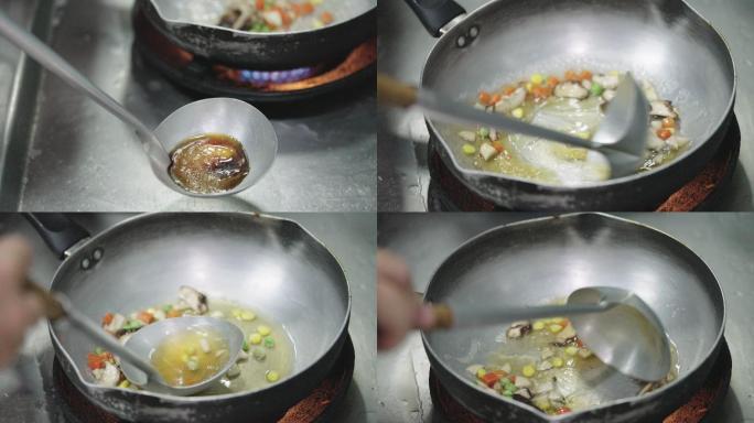 厨师用浓酱汁炒和调味混合蔬菜。