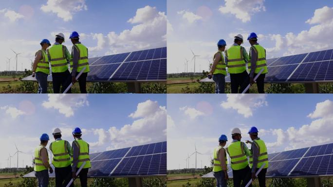蓝领工人电气工程师团队和建筑师持有风车场和太阳能电池板施工的咨询计划。景观设计使用风力涡轮机来产生纯
