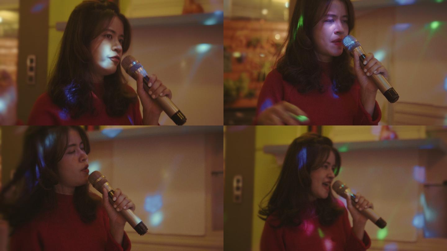 亚洲女性朋友团在卡拉OK唱歌和微笑