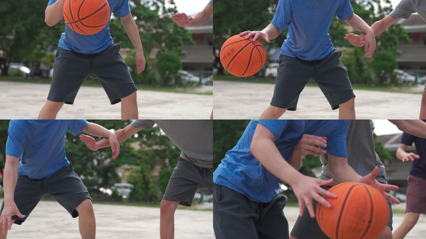 中段Z代亚裔中国少年在周末早上与朋友练习篮球比赛时挑战球员并投篮