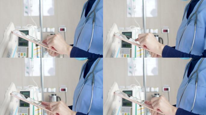 护士在医院病房使用数字平板电脑