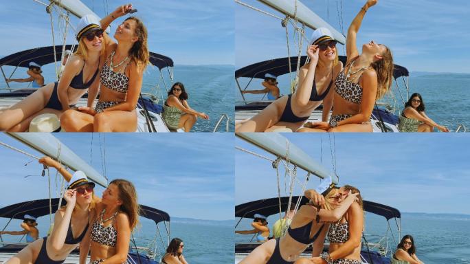 阳光明媚的日子里，两位女性朋友在游艇上晒日光浴时合影留念