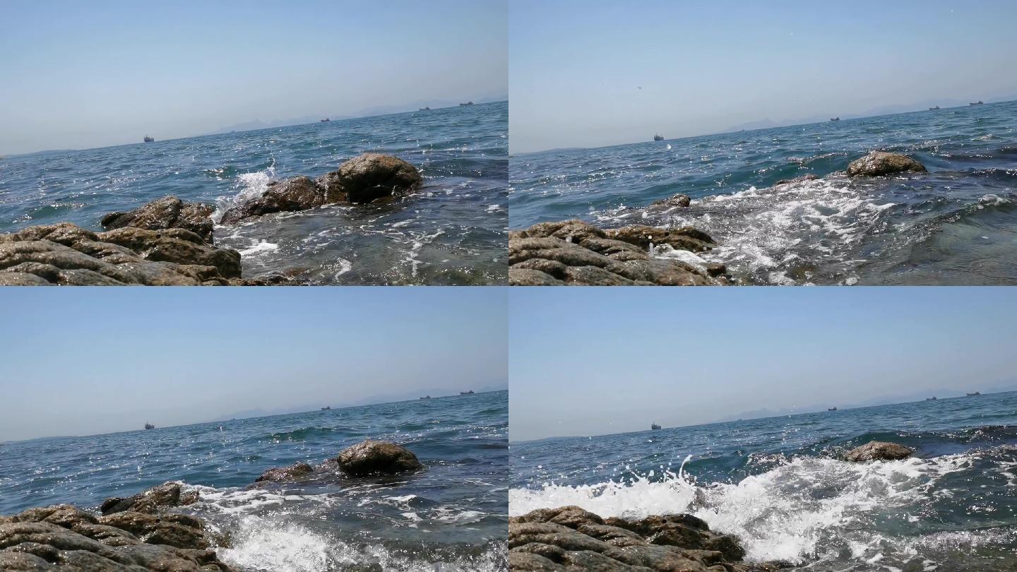海边海浪拍打岩石船