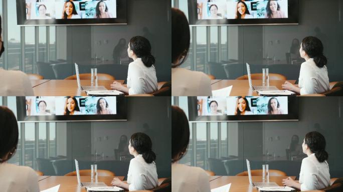 女商人通过视频会议与同事会面