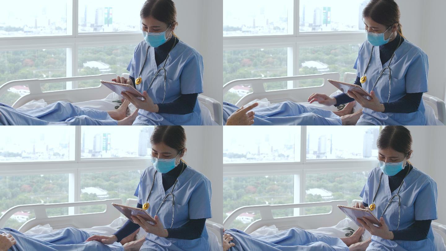 护士在医院病房使用数字平板电脑