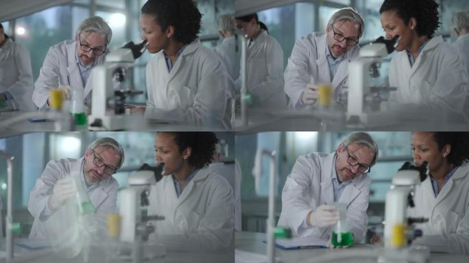 科学家在实验室研究化学物质时进行合作。