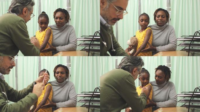 医生给年轻女孩注射疫苗