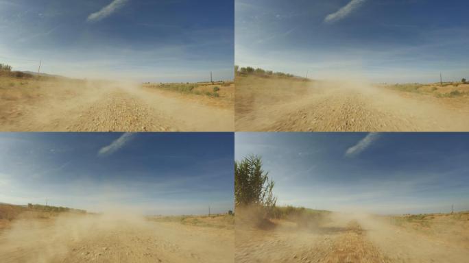 越野POV汽车驾驶：尘土飞扬的赛道上的后视图