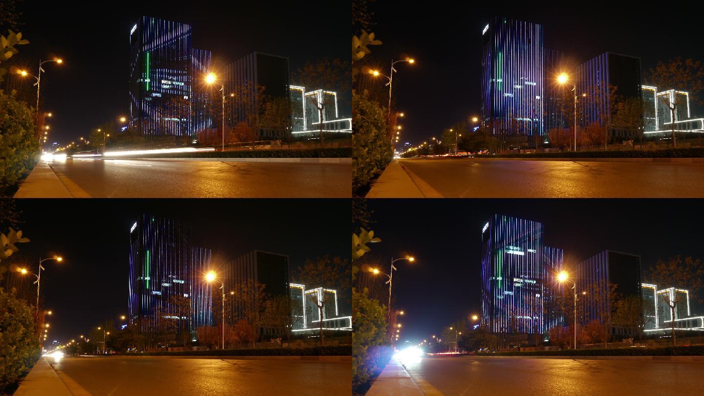 大楼附近的快车在夜间划出光带。4K