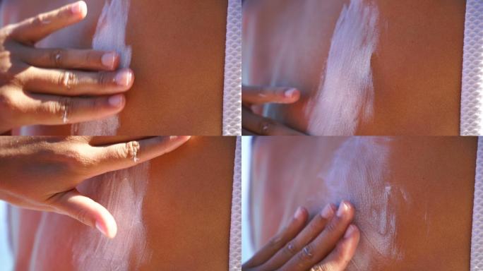 皮肤健康的迷人女性在身体上涂抹防晒霜
