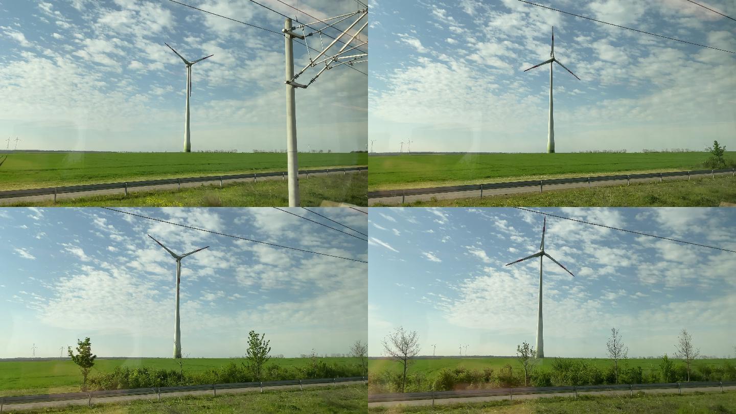从火车窗口拍摄的风力涡轮机