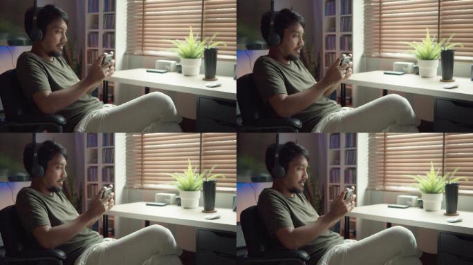 亚洲电子竞技选手用耳机玩电子游戏。