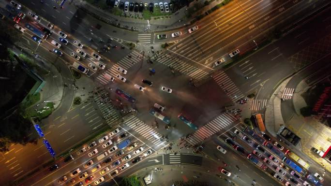 晚高峰城市路口交通民治大道布龙路上升航拍