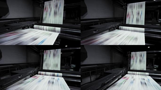 在印刷机的滚筒上快速运行的印刷纸张