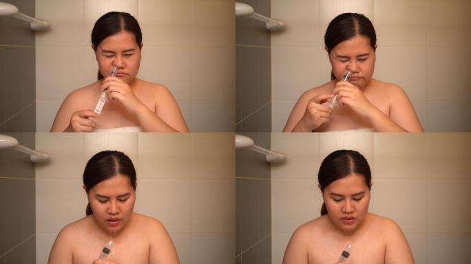 亚洲女性用盐水洗鼻子