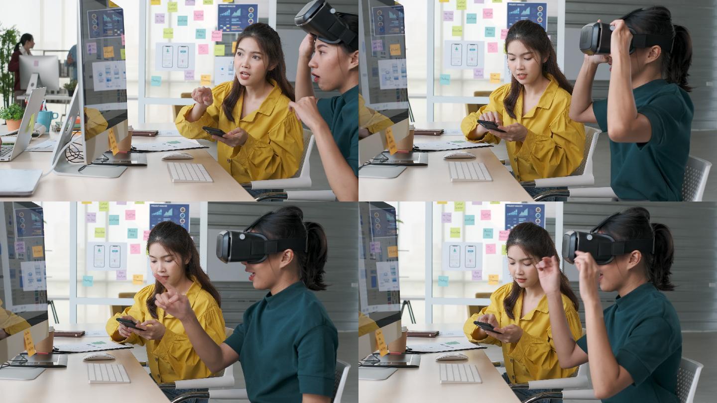 年轻的亚洲设计师团队戴着vr眼镜（虚拟现实）测试移动应用程序ux，在现代创意办公室用台式电脑开发软件