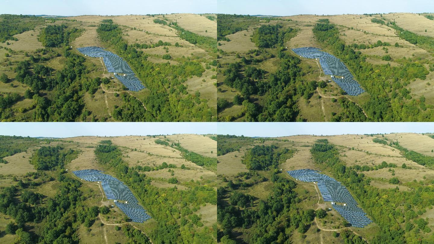 保加利亚山上有太阳能电池板，附近有绿树。绿色/清洁能源、太阳能、可持续能源发电厂和可持续资源的概念