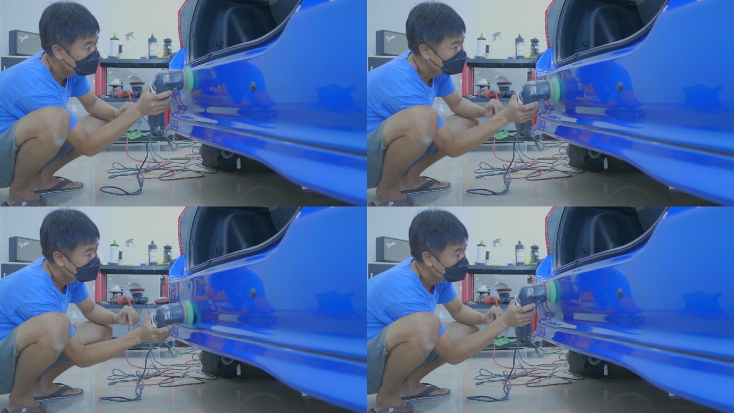 一名亚洲男子使用汽车抛光工具保养汽车漆面