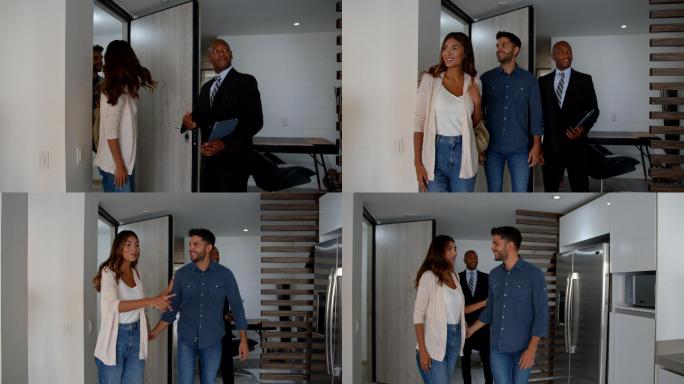 黑人房地产经纪人向对公寓感兴趣的年轻夫妇敞开大门，他们看起来非常高兴