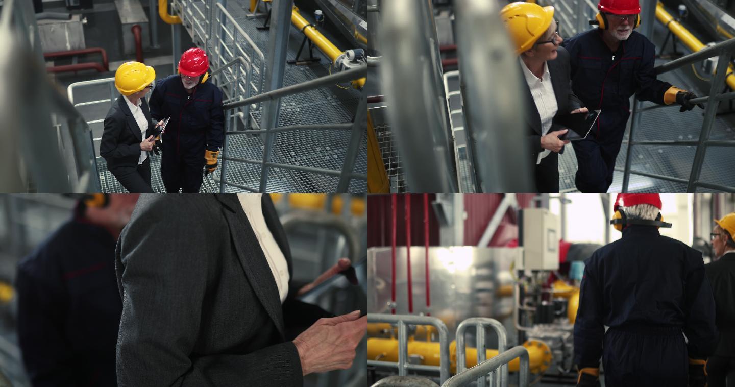 人工控制成功通过。主管和工人微笑着爬上供暖厂的一楼。