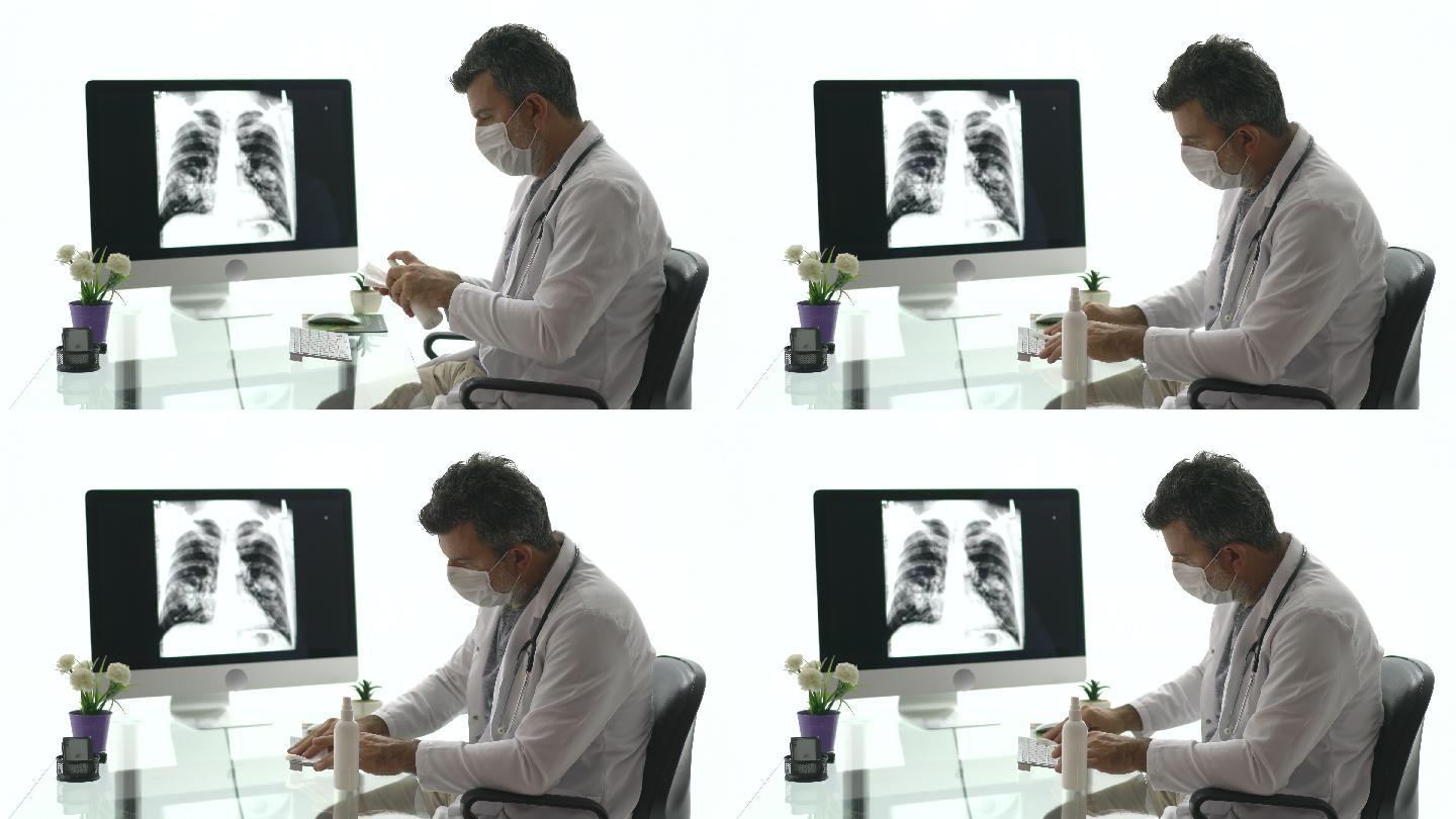 男医生用抹布给电脑键盘消毒。