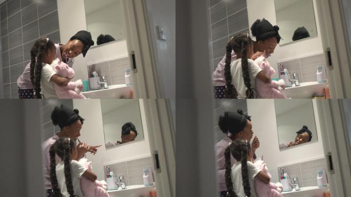 妈妈教小女儿刷牙洗漱母女洗手间
