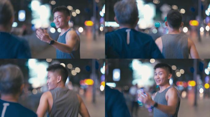 一名亚裔中国男子鼓励父亲下班后晚上在城里慢跑