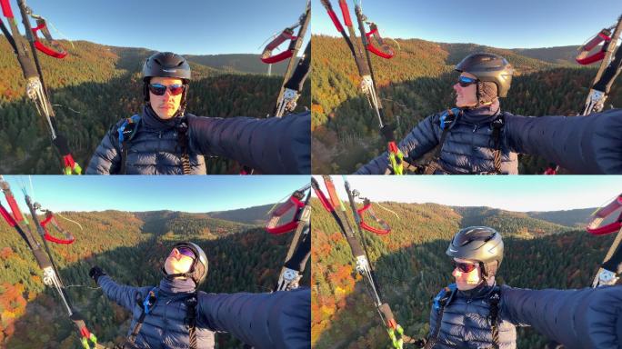 一个年轻人在山上滑翔伞的第一人称视图