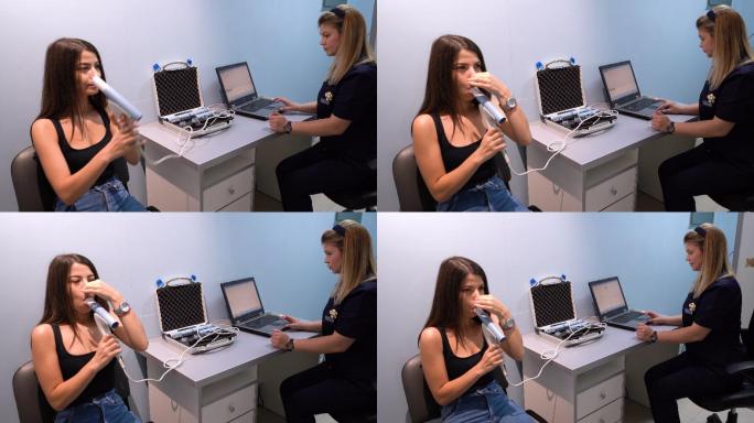年轻女性患者在医生办公室进行肺功能测试和肺活量测定