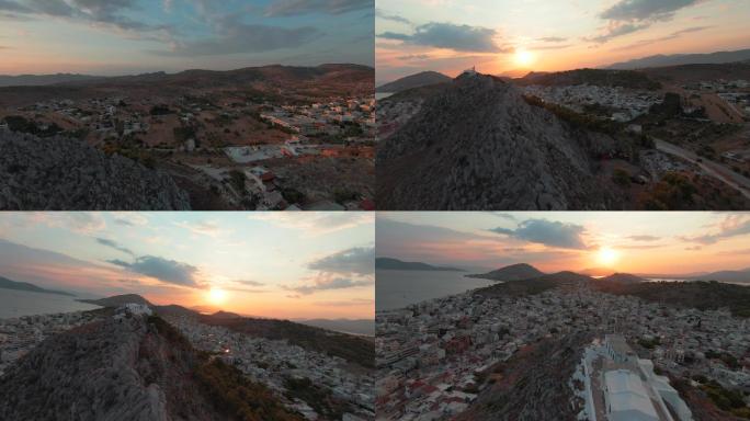 夏季日落时分，萨拉米斯岛和埃利亚斯先知教堂在落基山上空的空中全景fpv 60p镜头
