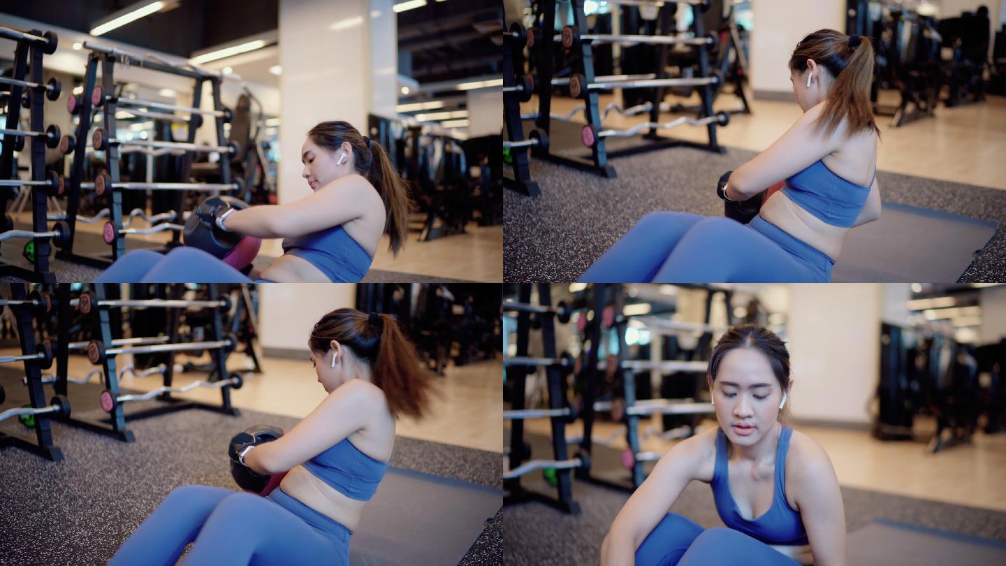 健身女性在健身房锻炼核心肌肉