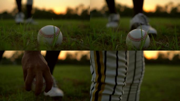 草地棒球赛捡起棒球