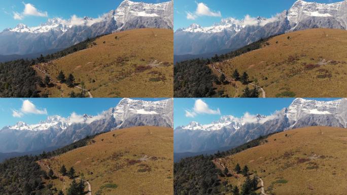 中国丽江的4k鸟瞰图和推拉田野背面和玉龙雪山景观。