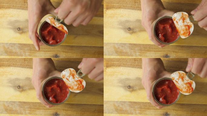 开切番茄罐头俯拍开罐用力撕扯