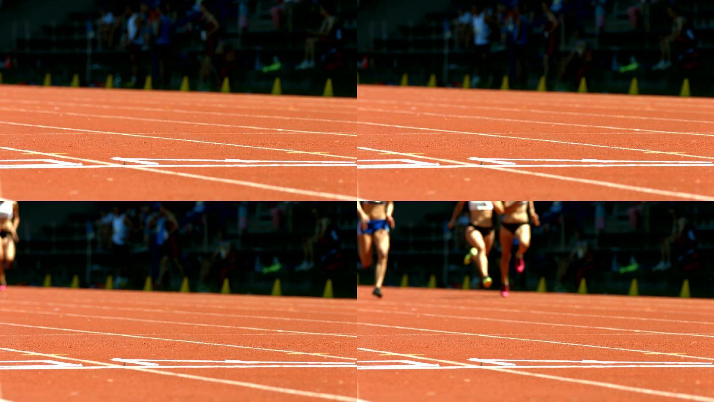 女子短跑运动员在终点线（4K/UHD到HD）
